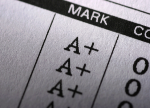 stock image of grades on a piece of paper